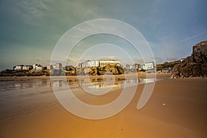 Buildings on a hill in Tenby South Beach, Wales