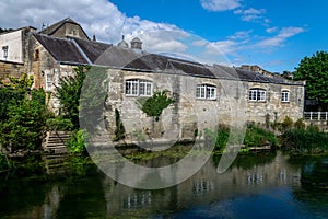 Buildings lining the River Avon at Bradford on Avon, Wiltshire, England