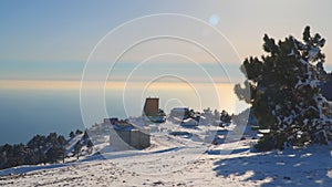 Buildings located on a snowy high plateau.