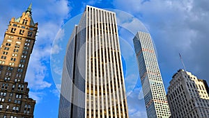 Buildings, modern and old architecture and blue sky in manhattan in new york