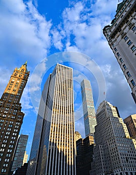 Buildings, modern and old architecture and blue sky in manhattan in new york