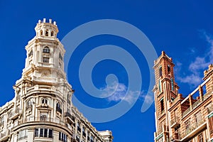 Buildings with modernist style towers in the Plaza del Ayuntamiento in Valencia photo