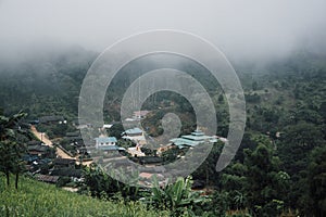 Buildings in mountain village. Foggy day, Top view village landscape
