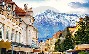 buildings and mountains in winter in Merano in Alto Adige - dolomites city in north italy