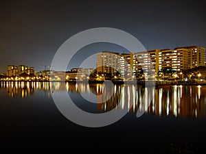 Buildings by Pandan reservoir under blue night sky photo