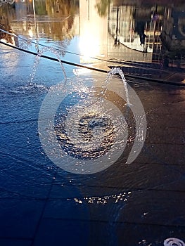 Buildings reflected in water fountain, Cleveland, Ohio