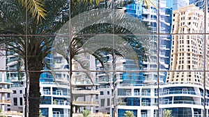 Buildings reflected in windows of modern office building