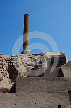 Buildings of rocks and chimney.