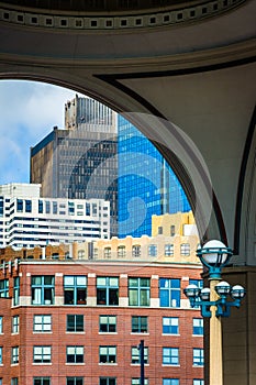 Buildings seen through the arch at Rowes Wharf in Boston, Massachusetts.