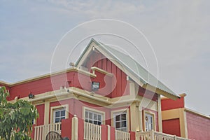 Buildings or shelters in the roof section with sky background