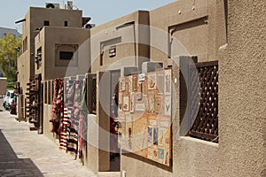 Buildings, shops and wind towers around the restored historic Al Fahidi area in Dubai, UAE
