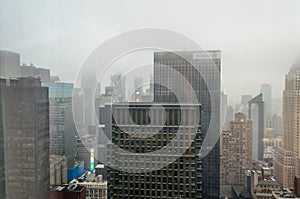 Buildings, Skyscrapers and Towers in Manhattan on a Foggy Day of Winter. Aerial View of New York City