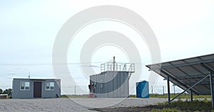 Buildings at the solar power station and a solar panel on the side, 4k