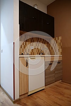 Built-in empty mini fridge in the kitchen