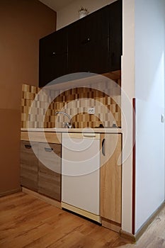 Built-in empty mini fridge in the kitchen