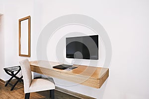 Built-in furniture in the modern hotel apartment room with chair, mirror