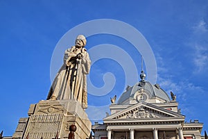 Statue of Mihai Cantacuzino standing holding a sword in front of landmark Coltea Hospital at Bucharest Romania photo