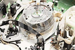 Built-in VCR, videorecorder round rotating video head for playing video cassettes.VCR tape transport mechanism. photo