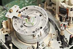Built-in VCR, videorecorder round rotating video head for playing video cassettes.VCR tape transport mechanism. photo