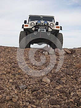 Built White Jeep Wrangler at Top of Hill in Arizona Desert