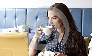 Buisness woman drinking cofee in restaurant photo