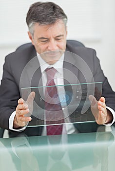 Buisnessman using futuristic touchscreen