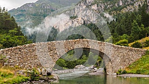 Bujaruelo ancient bridge in Pyrenees range, spain