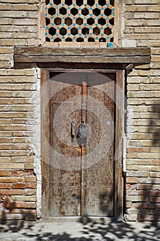 Meditation chamber for Sufis - artistically carved wooden door from Orient photo