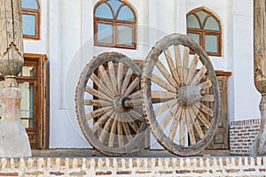 Antique wooden spoked wheel in Bukhara photo