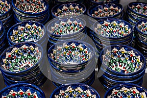 Bukhara. Uzbekistan. Shopping place. Ceramic cups and bowls decorated by traditional uzbek patterns. Blue pattern