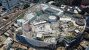 Aerial view of a construction site with crane in city center. Building of a new mall in Kuala Lumpur, Malaysia. Bukit Bintang City photo