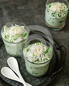 Buko Pandan, a dessert from Philippines, made from jelly, young coconut, evaporated milk, sweetened condensed milk, and ice. photo