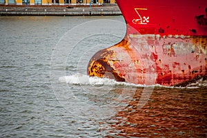 The bulb and bow of a red ship
