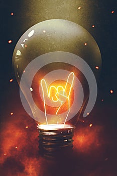 The bulb with glowing devil horns sign gesture hand