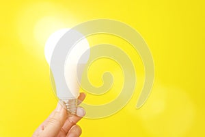 Bulb Light In Hand. Copy space. Idea concept. Power saving concept