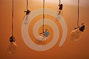 Bulbs hanging on an orange background