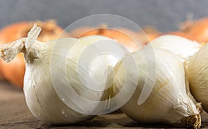 Bulbs of onions & x28;Allium cepa& x29; on concrete background