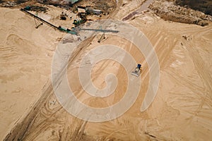 Buldozer machinery work in in opencast sand quarry