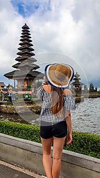 Buleleng - A woman admiring Ulun Danu Temple