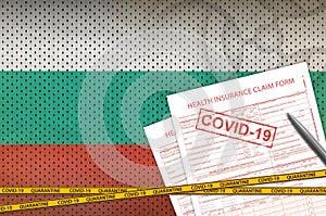 Bulgaria flag and Health insurance claim form with covid-19 stamp. Coronavirus or 2019-nCov virus concept