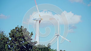 Bulgaria, Shabla: Wind energy turbines on beautiful blue sky with white clouds. Renewable energy sources, enviro