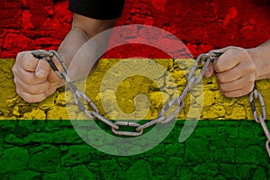 Bulgariamale hands break iron chain, symbol of bondage, protest against background of national flag of bolivia, concept of