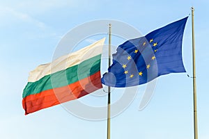 Bulgarian flag and european flag together floating on the wind.