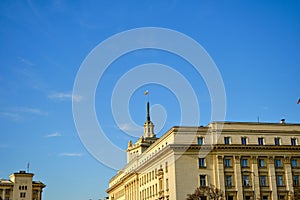 Bulgarian flags on government buildings in sofia during sunny day.