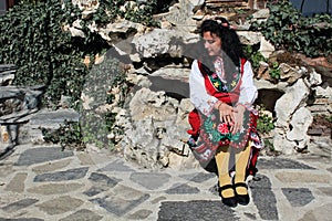 A Bulgarian girl in a traditional folklore costume