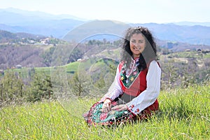 A Bulgarian girl in a traditional folklore costume