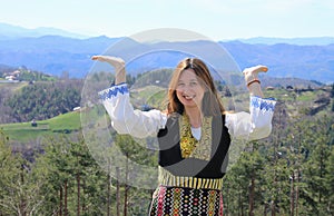 A Bulgarian girl in a traditional folklore costume