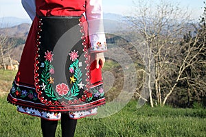 A Bulgarian girl in a traditional folklore costume