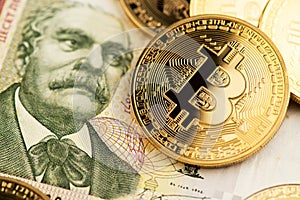 Bulgarian Lev currency banknotes and BTC Bitcoin cryptocurrency coins. Bitcoin Cryptocurrency concept.