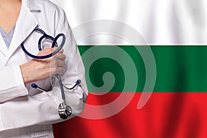 Bulgarian medicine and healthcare concept. Doctor close up against flag of Bulgary background